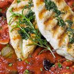 Fesa di tacchino con pomodori e olive