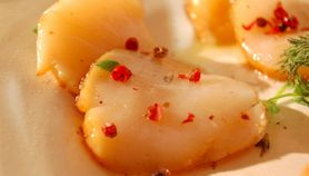 Capesante all'arancia e pepe rosa