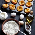 Yorkshire puddings in a metal baking tray