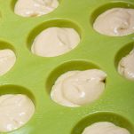 Silicone molds filled with dough for cupcake