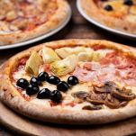 Pizza Four Seasons on wooden table