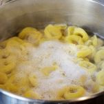 tortellini cooking in boiling water