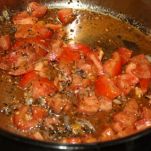 Spaghetti con coda di rospo melanzane e pomodori