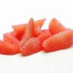 peeled grapefruits in a white background