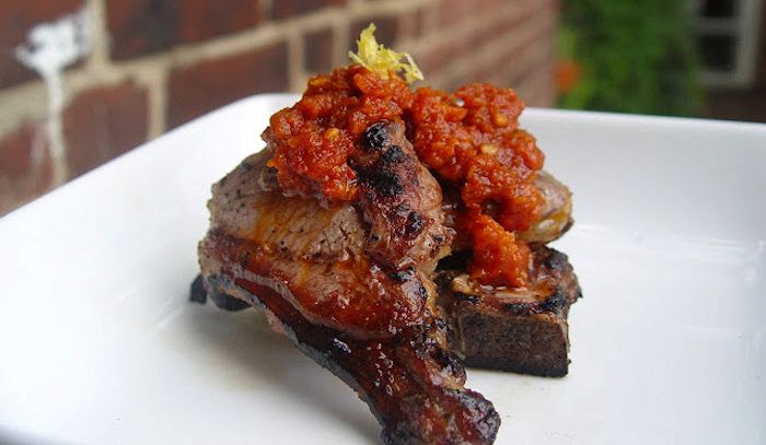 Agnello con pomodori secchi