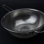 15167975 &#8211; stainless sieve on a black background