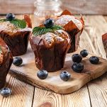 Muffins with blueberries on a wooden background. homemade baking
