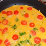 Uova ai peperoni e pomodoro