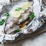 Raw rainbow trout in foil
