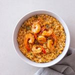 Risotto with shrimps, tomatoes and thyme. Italian food