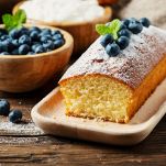 Homemade plum cake with yougurt and berry, rustic style and selective focus