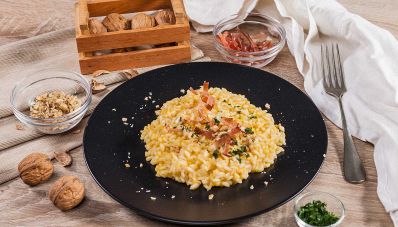 Risotto alla zucca con speck, porri e noci