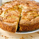 Apple cake with cinnamon on a wooden table