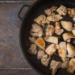 Fried chicken in the pan top view
