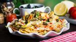 Farfalle con vongole, zucchine e pomodorini