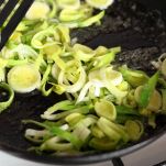 Frying leek in butter. Making Potato and Leek Filo Pie. Series.