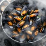 Conchiglie aperte in padella