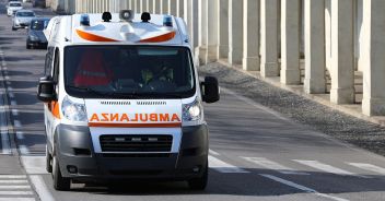 Fast Italian ambulance runs to the city street during a Medical Emergency