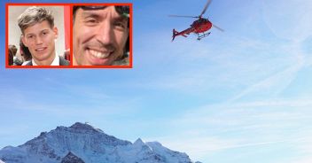 Red helicopter flying at Swiss Alps mountain Mannlichen in winter, Switzerland