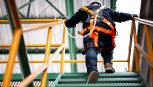 Construction worker wearing safety harness