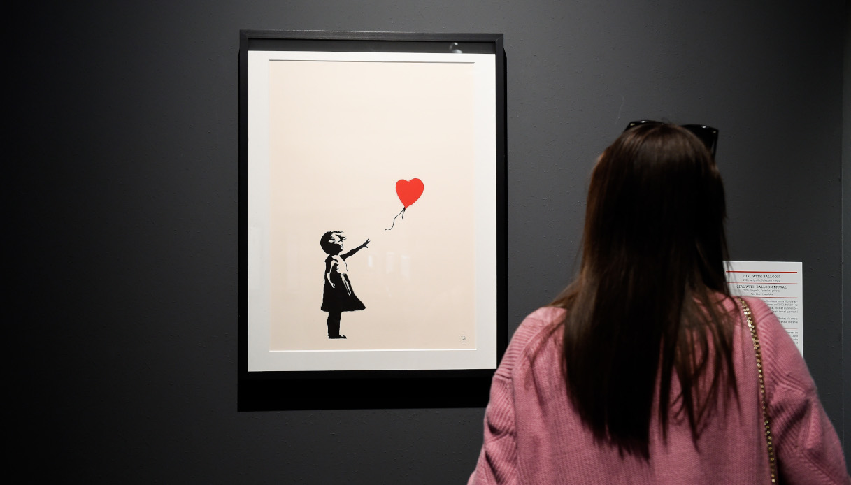bambina palloncino cuore banksy