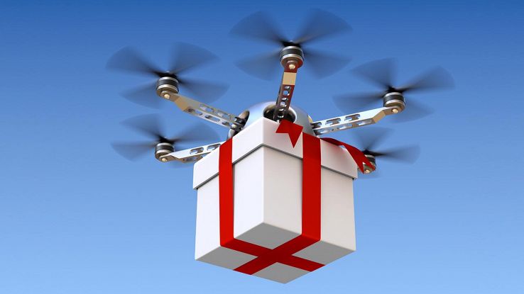un drone trasporta un pacco di Natale