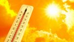 Atmosfera calda con termometro e sole