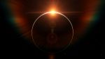 Eclissi in toni arancio e neri con flare