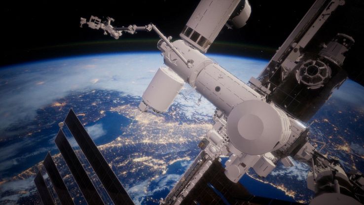 Pianeta e stazione spaziale in orbita