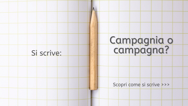 Scritta “Si scrive campagnia o campagna? Scopri come si scrive...” su quaderno a quadretti grande con una matita nella piega centrale