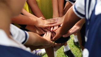 group of young people's hands