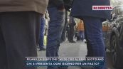 Milano, la gente che chiede cibo al Pane quotidiano